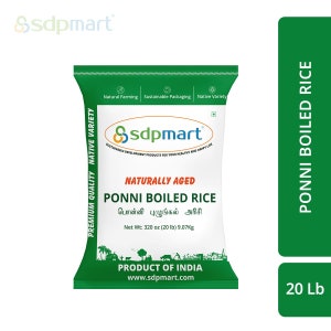 May include: A green bag of Ponni Boiled Rice, a naturally aged rice variety. The bag features the text "Ssdpmart" and "Naturally Aged Ponni Boiled Rice" in white lettering. The bag also includes the text "Product of India" and the website address "www.sdpmart.com". The bag is labeled as a 20 lb (9.07 kg) bag.