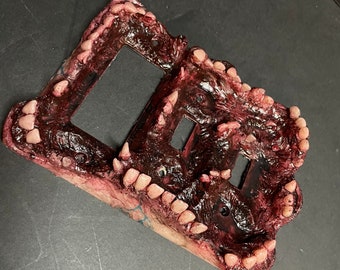 Double Monstrous light switch cover with toggle.