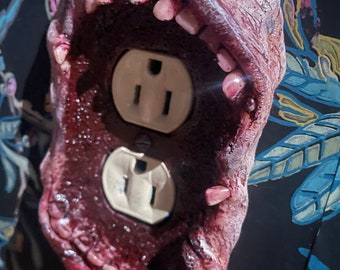 Monstrous outlet cover