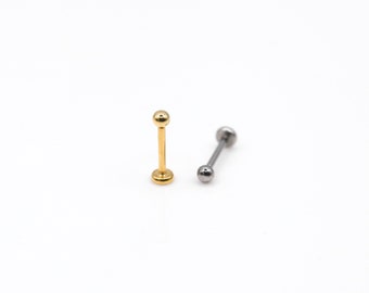 May include: Two barbell style body piercing jewelry pieces. One is gold with a ball on each end. The other is silver with a ball on each end.