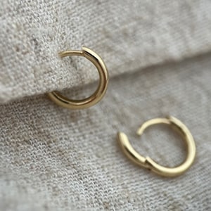 9ct solid gold 8mm internal diameter luxe huggie hoops. Sold as singles or pair