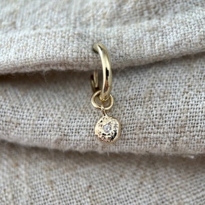 Midi 9ct molten gold hoop charm with a genuine diamond solid recycled yellow gold huggie earrings. Single earring.