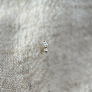 Little princess cut natural white diamond with tiny round diamond in 9ct yellow gold. Sold as a single