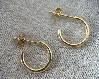 9ct gold 10mm internal diameter small hoops with post and butterfly. Sold as singles