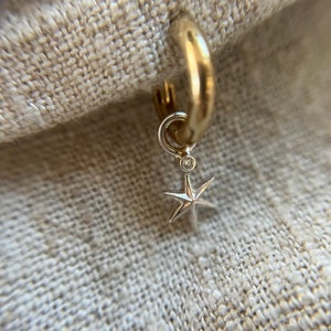 Silver star with a tiny sparkling genuine diamond charm with choice of Sterling silver or gold small hoop huggie. Sold as single.