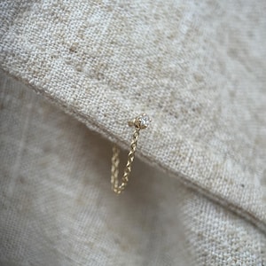 Genuine tiny princess cut diamond ear stud with chain set in 9ct yellow gold. Single earring.
