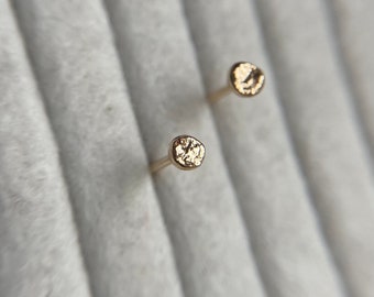 Mini 9ct molten gold ear studs in solid yellow gold earrings