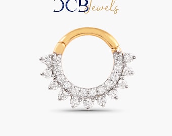 May include: A gold and silver clicker hoop earring with a row of small diamonds around the hoop and a larger diamond on each side of the hoop.
