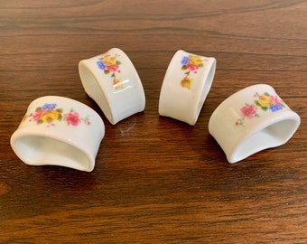 Set of four Vintage Genuine Porcelain Napkin Rings Holders Blue, Pink and Yellow Floral Design