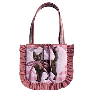 May include: A set of three ceramic mugs with a speckled, matte finish. The mugs are in shades of cream, light grey, and dark grey. Each mug has a simple, minimalist design, ideal for coffee or tea.