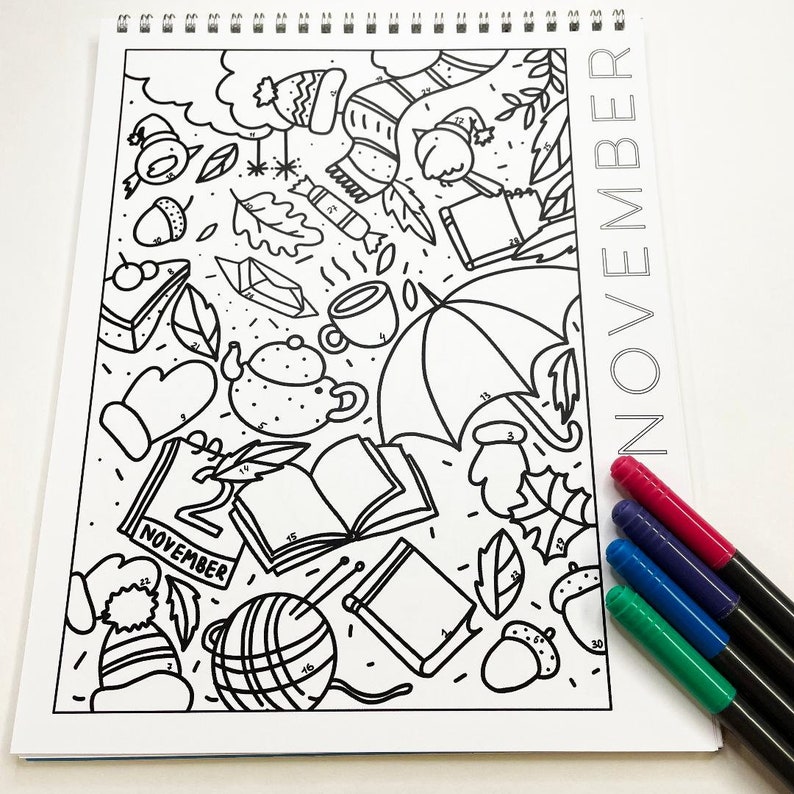 May include: A black and white coloring page with the number 2 and the word "November" on it. The page is filled with various images related to the month of November, such as a teapot, a book, a hat, and an umbrella.