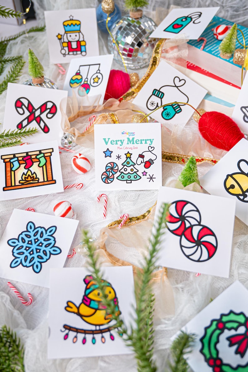 May include: A collection of square cards featuring colorful Christmas-themed illustrations including a nutcracker, candy canes, stockings, a snowflake, a bird, and peppermint candies. The center card displays the text Very Merry Mini Coloring Book.