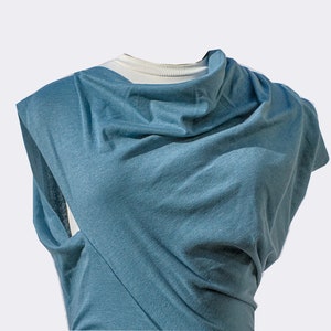 Contemporary, asymmetrical top. Lt. teal. Grey.