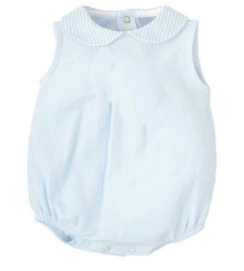 May include: A sleeveless light blue bubble romper featuring a textured fabric and a rounded Peter Pan collar with a white and light blue striped pattern. The garment includes a single button closure at the back neckline and snap closures at the bottom.