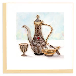 May include: A greeting card featuring a detailed illustration of a silver and gold teapot, a small glass, and a bowl with sugar cubes. The teapot has intricate patterns and a red gem. The background is a soft watercolor wash.