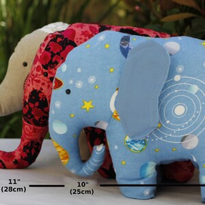 Elephant Plush 
Size Comparison Chart: Elephant with trunks bent in toward belly is 10 inches (33cm) in length. Elephant with trunk out is 11 inches (28cm) in length. Elephant with trunk out and up is 13 inches (25cm) in length.