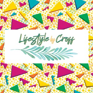 May include: A vibrant pattern with yellow polka dots, geometric shapes, and a white rectangle with the text "Lifestyle by Croff" and a blue leaf design. The design includes pink, yellow, green, and blue triangles.
