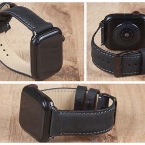 May include: Black leather watch band with white stitching for an Apple Watch. The band is shown on a black Apple Watch.