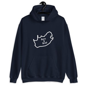 May include: A navy blue hoodie with a white outline of the South African map and the text "Born & Bred" inside the map.