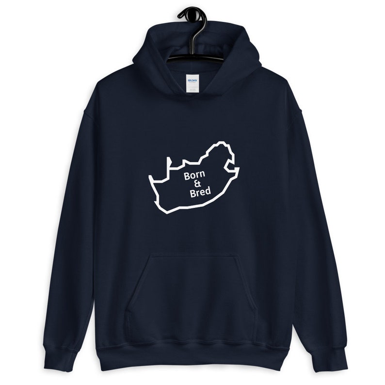 May include: A navy blue hoodie with a white outline of the South African map and the text "Born & Bred" inside the map.