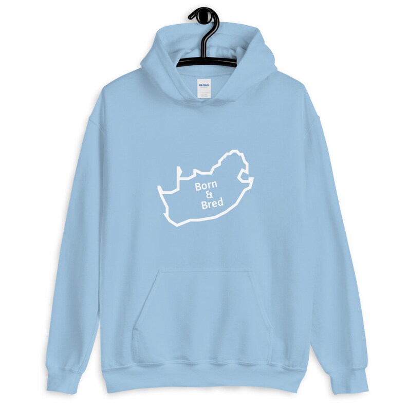 May include: Light blue hoodie with a white outline of the map of South Africa and the text "Born & Bred" on the front.