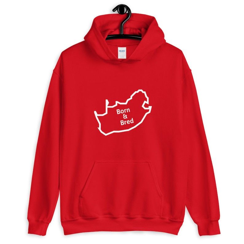 May include: Red hooded sweatshirt with a white outline of the map of South Africa and the text "Born & Bred" in white.