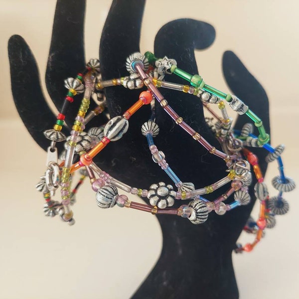 Set of 12 Handmade Fun Multi-Colored Wire Beaded Bracelets with Clasp Lock Closure. Girls Child Sizes. One size fits most. New. Fashionable