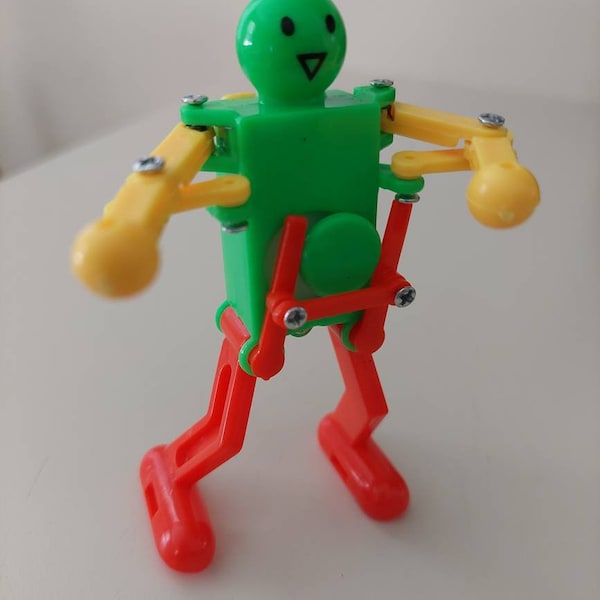 3.5 "Divertido Wind-up Dancing Robot Toy Rojo Verde y Amarillo. Hace un gran regalo de Navidad navideño o relleno de medias. Envíos vía USPS.