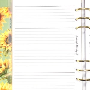 May include: A planner with lined pages, gold rings, and tabs labelled "Goals", "This Week", and "Notes". The planner has a sunflower design on the cover and the words "Dream Life Planning Co" are visible on a page.