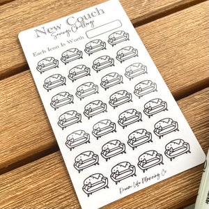 May include: A white sheet of stickers with black outlines of couches. The sheet says "New Couch Savings Challenge" and "Each Icon Is Worth". The bottom of the sheet says "Dream Life Planning Co."
