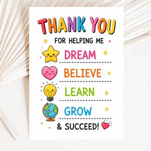 May include: A white greeting card with the text THANK YOU FOR HELPING ME DREAM, BELIEVE, LEARN, GROW & SUCCEED! The design features colorful cartoon icons including a yellow star, a pink heart, a lightbulb, and a globe, all with smiling faces.
