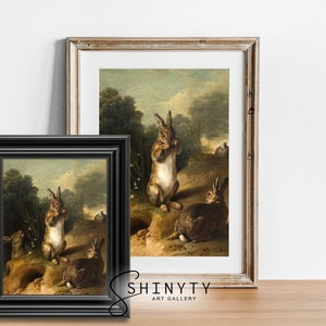 May include: A vintage oil painting depicting four rabbits in a woodland setting. The rabbits are brown and white with long ears and are depicted in a natural pose. The painting is framed in a black frame.