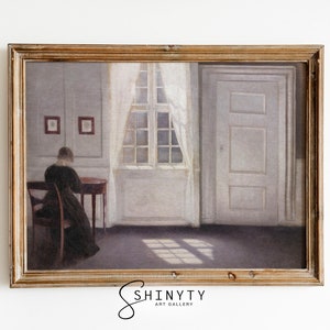 May include: A framed painting depicting a woman in a dark dress sitting at a table in a room with a window and a door. The room is painted in shades of gray and white, with sunlight streaming through the window.