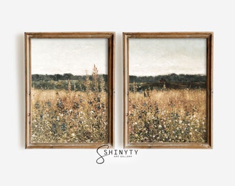 May include: Two framed prints of a landscape painting depicting a field of wildflowers in shades of green, brown, and white. The field is in the foreground with a line of trees in the background.