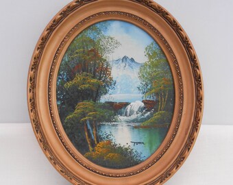 Vintage Oil Painting of a Waterfall and Mountain Scene in an Oval Gold Coloured Frame - Landscape Painting