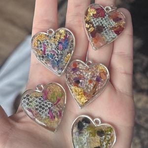 Heart shaped pendant necklace with real snakeskin - made with resin, dried flowers, and stones