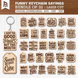 May include: A bundle of 32 laser-cut wooden keychains with funny sayings. The keychains feature various shapes and phrases like "I Gotta Good Heart But This Mouth" and "Swear Because Care".