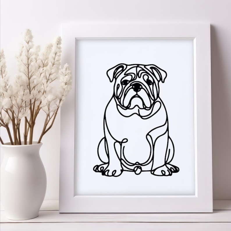 May include: A black and white line art print of a bulldog sitting. The print is framed in a white frame.