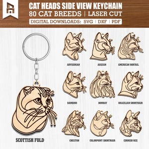 May include: A wooden keychain with a Scottish Fold cat design and a silver keyring. The image shows laser-cut cat head designs of breeds like Abyssinian and Bombay. Text reads: "CAT HEADS SIDE VIEW KEYCHAIN". The product is laser cut.
