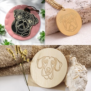 May include: Three different dog portraits on round wooden and metal plaques. The first plaque is pink and features a black pug. The second plaque is gold and features a bulldog. The third plaque is light brown wood and features a dachshund.
