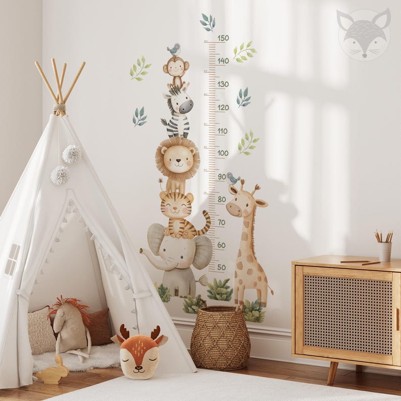 May include: A white teepee tent with a brown and white striped rug in front of it. A growth chart with a giraffe, elephant, tiger, lion, zebra, and monkey stickers is on the wall. The chart has numbers from 50 to 150.