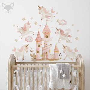 May include: Pink and gold castle with unicorn wall decals for a nursery or child's room. The decals feature a pink castle with gold accents, a unicorn with a pink mane and tail, and stars.