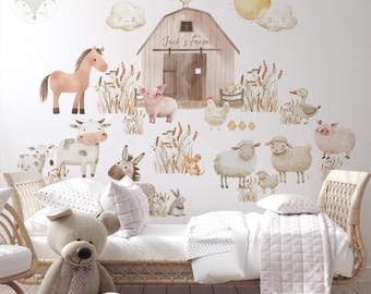 May include: A white wall with a farm-themed wall decal set. The decal set includes a barn, animals, a sun, clouds, and grass. The barn has the text "Jack's Farm" on it.