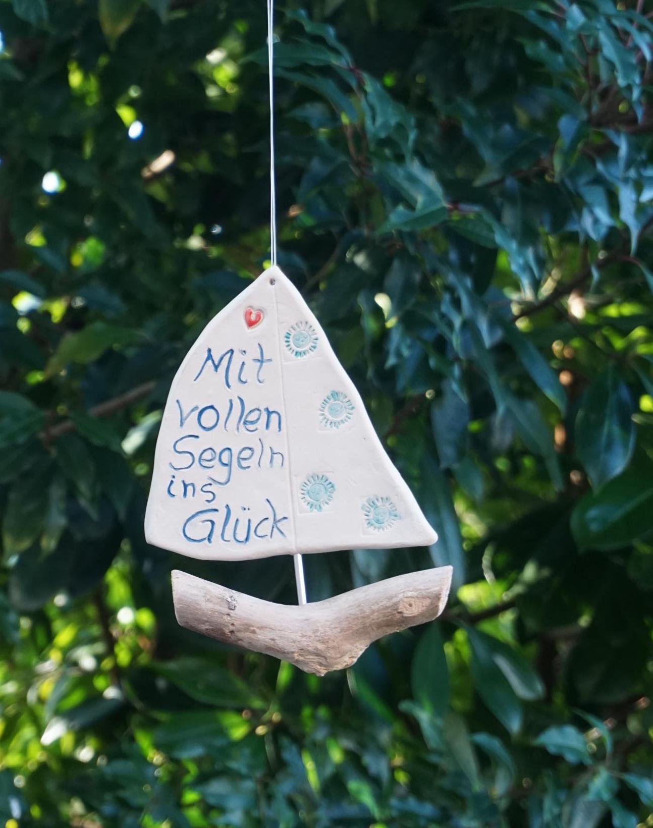 ceramic sailboat with saying