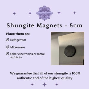 May include: A round, black Shungite magnet, 5cm in diameter, is shown attached to a metal surface. Text on a lavender background reads "Shungite Magnets - 5cm" and "Place them on: Refrigerator, Microwave, Other electronics or metal surfaces."