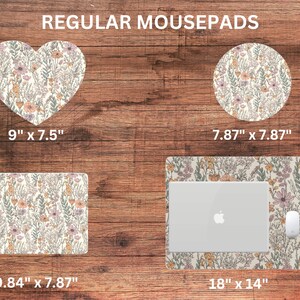 May include: Four different sizes of mousepads with a floral pattern in shades of pink, yellow, and green on a white background. The mousepads are shown on a wooden surface. The sizes are 9 inches by 7.5 inches, 7.87 inches by 7.87 inches, 9.84 inches by 7.87 inches, and 18 inches by 14 inches.