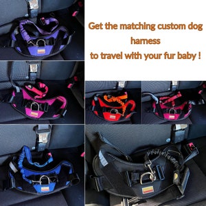 May include: Five different color dog harnesses with leashes attached. The harnesses are black with a contrasting color panel in the front. The colors are purple, pink, red, blue, and orange. The text "Get the matching custom dog harness to travel with your fur baby!" is displayed above the harnesses.