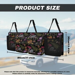 May include: Black car organizer with a mushroom and fern pattern. The organizer is 37.01 inches wide and 11.81 inches high. It has multiple pockets and hanging straps. The text "PRODUCT SIZE" is at the top.