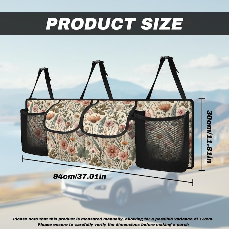 May include: A floral patterned car seat organizer with three compartments and two mesh pockets. It measures 37.01 inches wide and 11.81 inches tall.