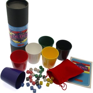 May include: A 6-player Peruvian dice game called "Dudo!" with colourful cups, dice, and a red velvet bag. The game is packaged in a black tube with the game's name and instructions.
